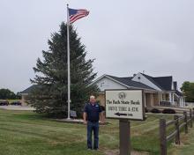 bsb president outside of bath location with usa flag